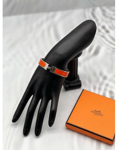 (LIKE NEW) HERMES CLIC H BRACELET IN PALLADIUM PLATED WITH ORANGE ENAMEL