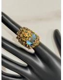 (LIKE NEW) GUCCI LION HEAD RING SIZE 16 IN ANTIQUED GOLD METAL WITH LIGHT BLUE CRYSTAL