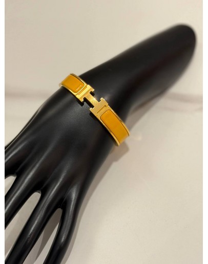 (LIKE NEW) HERMES CLIC H BRACELET IN YELLOW GOLD PLATED WITH JAUNE MADRAS ENAMEL