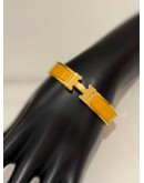 (LIKE NEW) HERMES CLIC H BRACELET IN YELLOW GOLD PLATED WITH JAUNE MADRAS ENAMEL