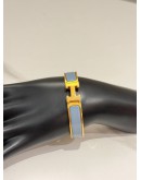 (LIKE NEW) HERMES CLIC H BRACELET IN YELLOW GOLD PLATED WITH BLEU ORAGE ENAMEL
