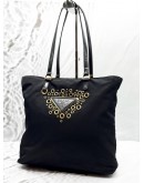 PRADA LOGO GROMMET TOTE BAG IN BLACK NYLON WITH LEATHER