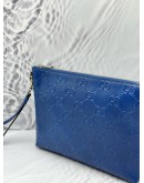GUCCI WRISTLET MESSENGER BAG IN BLUE GG EMBOSSED LEATHER