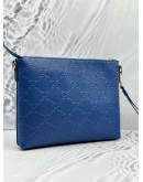 GUCCI WRISTLET MESSENGER BAG IN BLUE GG EMBOSSED LEATHER