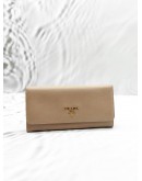 PRADA LONG FLAP WALLET IN BEIGE SAFFIANO LEATHER