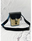 COACH TRACK CROSSBODY BAG IN BEIGE CC SIGNATURE CANVAS WITH BLACK AND BLUE LEATHER 