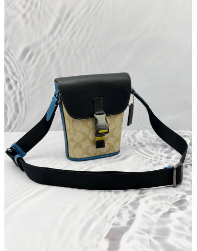 COACH TRACK CROSSBODY BAG IN BEIGE CC SIGNATURE CANVAS WITH BLACK AND BLUE LEATHER 