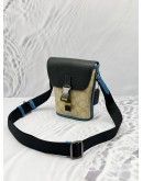 COACH TRACK CROSSBODY BAG IN BEIGE CC SIGNATURE CANVAS WITH BLACK AND BLUE LEATHER 