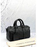 LOUIS VUITTON KEEPALL BANDOULIERE 25 BAG IN BLACK MONOGRAM TAURILLON LEATHER 