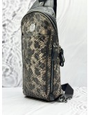 MCM SMALL STARK STUDDED CROSSBODY BAG IN BLACK WITH BROWN SNAKE PRINT LEATHER