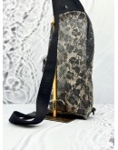 MCM SMALL STARK STUDDED CROSSBODY BAG IN BLACK WITH BROWN SNAKE PRINT LEATHER