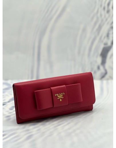 PRADA BOW CONTINENTAL WALLET IN PINK SAFFIANO LEATHER