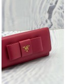 PRADA BOW CONTINENTAL WALLET IN PINK SAFFIANO LEATHER