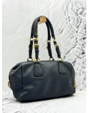 PRADA BAULETTO SHOULDER BAG IN BLACK VITELLO DAINO LEATHER