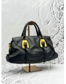 PRADA BAULETTO TOP HANDLE AND SHOULDER BAG IN BLACK CALFSKIN LEATHER