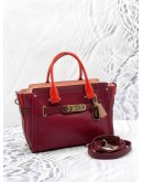 (UNUSED) COACH SWAGGER CARRYALL BURGUNDY RED HANDLE CROSSBODY / SHOULDER HANDBAG WITH LONG STRAP