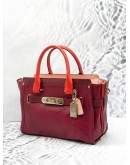 (UNUSED) COACH SWAGGER CARRYALL BURGUNDY RED HANDLE CROSSBODY / SHOULDER HANDBAG WITH LONG STRAP