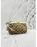COACH POUCH IN BEIGE CC CANVAS AND IVORY CALFSKIN LEATHER