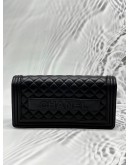 CHANEL BOY CLUTCH IN BLACK LAMBSKIN LEATHER