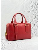 PRADA BAULETTO TOP HANDLE BAG IN RED SAFFIANO LUX LEATHER