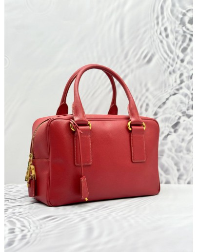 PRADA BAULETTO TOP HANDLE BAG IN RED SAFFIANO LUX LEATHER