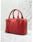 PRADA BAULETTO TOP HANDLE BAG IN RED SAFFIANO LUX LEATHER