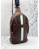 (LIKE NEW) COACH CHARLES VARSITY LEATHER PACK SLING IN DARK SADDLE 