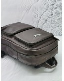 TUMI BROWN LEATHER BACKPACK