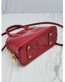 LOUIS VUITTON ALMA BB TOP HANDLE BAG IN RED PATENT LEATHER WITH STRAP