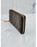 (LIKE NEW) LOUIS VUITTON CLEMENCE LONG WALLET IN BROWN MONOGRAM CANVAS WITH PUMPKIN YELLOW INNER LINING