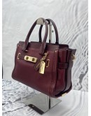 COACH SWAGGER CARRYALL BURGUNDY CROSSBODY / SHOULDER HANDBAG WITH LONG STRAP