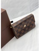 LOUIS VUITTON TRI-FOLD WALLET IN BROWN DAMIER EBENE CANVAS