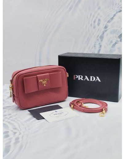 (UNUSED) PRADA BOW RIBBON SAFFIANO LEATHER ZIPPED SMALL CAMERA CROSSBODY BAG IN PINK -FULL SET-