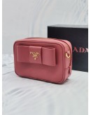 (UNUSED) PRADA BOW RIBBON SAFFIANO LEATHER ZIPPED SMALL CAMERA CROSSBODY BAG IN PINK -FULL SET-