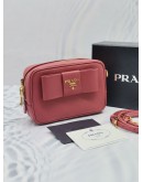 (UNUSED) PRADA BOW RIBBON SAFFIANO LEATHER ZIPPED SMALL CAMERA CROSSBODY BAG IN PINK -FULL SET-