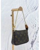 LOUIS VUITTON MINI POCHETTE ACCESSOIRES IN BROWN MONOGRAM CANVAS