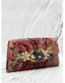 JUDITH LEIBER EXPLORES CRYSTAL AND EXOTICE IN MUTICOLOR PYTHON LEATHER DINNER CLUTCH