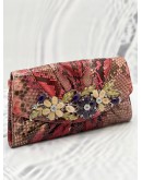 JUDITH LEIBER EXPLORES CRYSTAL AND EXOTICE IN MUTICOLOR PYTHON LEATHER DINNER CLUTCH