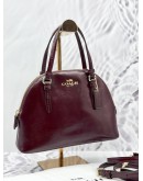 COACH DOME CROSSBODY BAG IN BURGUNDY PATENT LEATHER