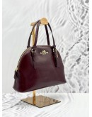 COACH DOME CROSSBODY BAG IN BURGUNDY PATENT LEATHER