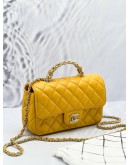 (LIKE NEW) MICROCHIP CHANEL RHINESTONE HANDLE GOLD CC LOGO YELLOW FLAP BAG 