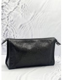 GUCCI EMBOSSED MONOGRAM POUCH 