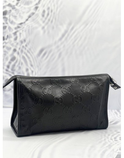 GUCCI EMBOSSED MONOGRAM POUCH 