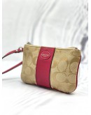 COACH CORNER ZIP WRISTLET POUCH KHAKI SIGNATURE CANVAS DARK PINK