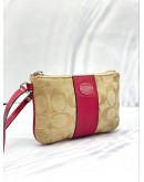 COACH CORNER ZIP WRISTLET POUCH KHAKI SIGNATURE CANVAS DARK PINK