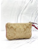 COACH CORNER ZIP WRISTLET POUCH KHAKI SIGNATURE CANVAS DARK PINK